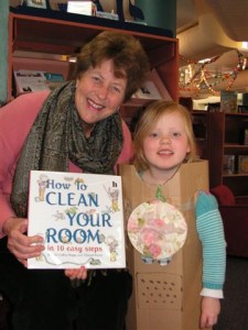  Jill and Amelia choose a book at the Library