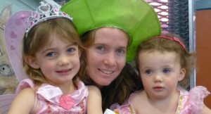  Sienna with mum Amy and sister Ebony dressed up for Storytime