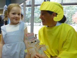 Dorothy (Gaby) chats with Storyteller Fiona dressed as Yellow Brick Road