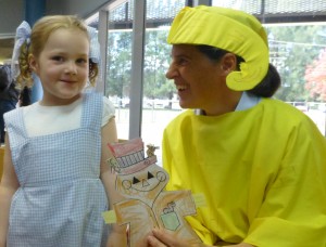 Dorothy (Gaby) chats with Storyteller Fiona dressed as Yellow Brick Road