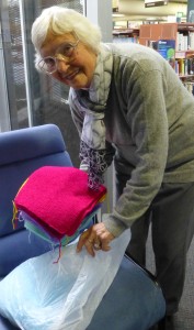 Pauline helps pack bags of donated squares