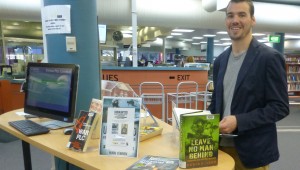 Author Hugh O'Brien checks out military books 
