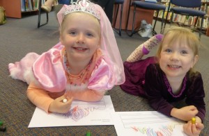 Gracie and Ave coloured in their own tiaras
