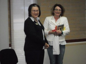 Cowra Branch Librarian Caroline presents Maggie with a gift