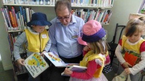 Peter reads with Tyrone, 4,  and Matilda, 4 at Forbes Library