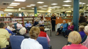 Librarian Trudi updates volunteer knitters