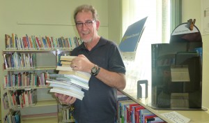Peter with another stack of books