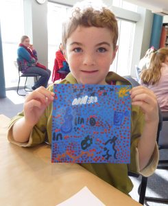 Campbell shows off his dot painting